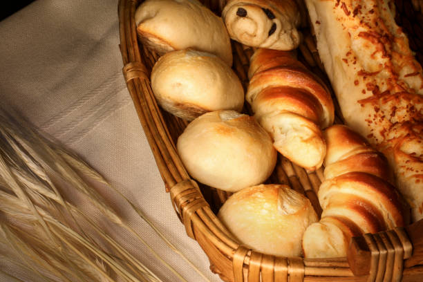 istock Wooden basket full of sorted breads 1457908886