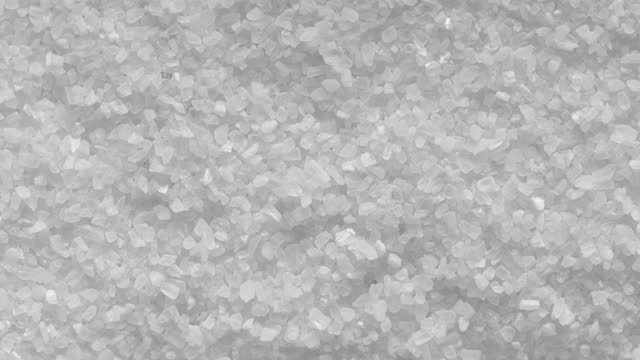 Salt grain crystals moving.