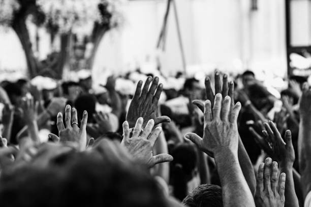 Hands pointing to the sky at brazilian catholic festival People praying at "círio de nazaré", a brazilian religious festival that happens at october's second sunday every year. cirio de nazare stock pictures, royalty-free photos & images