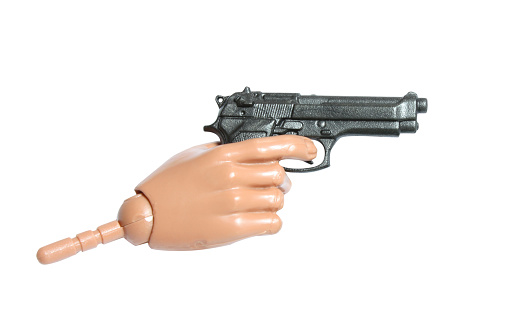 Small plastic hand holding a beretta pistol for cutout. Scale toy.