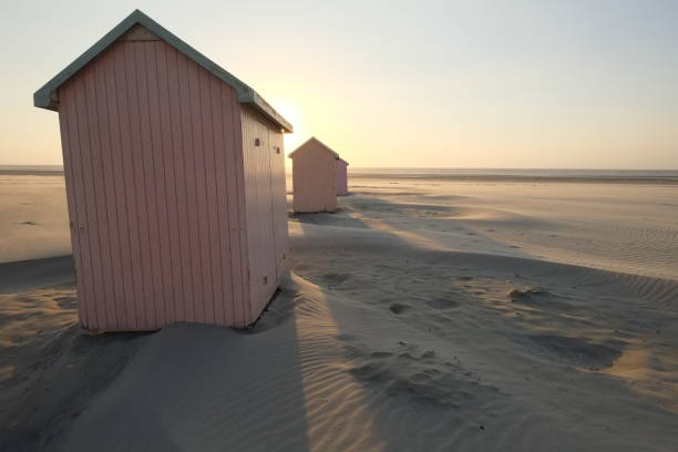 istock Some Beach cabins on the beach during sunset. 1457910565