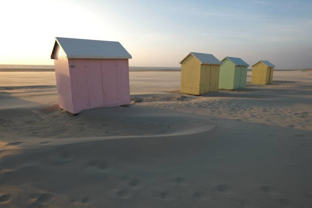 istock Some Beach cabins on the beach during sunset. 1457910729
