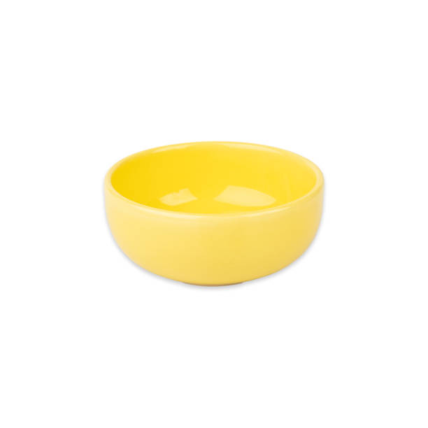 istock Yellow ceramic bowl isolated over white background 1457912120