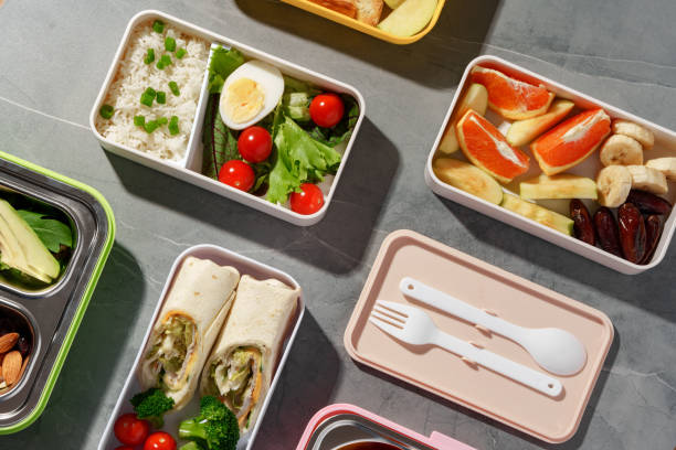 istock Containers with healthy food on gray background top view. 1457912434