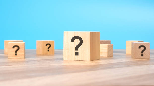istock front view on many wood cubes with question marks. many question arising concept. trouble and confusion. 1457917943