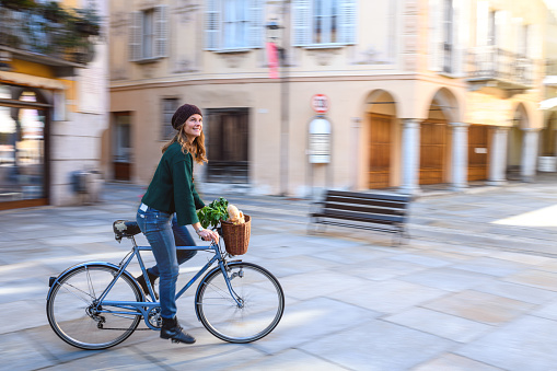 Tourist in Italian town, Varallo, Piedmont, bicycle motion blur