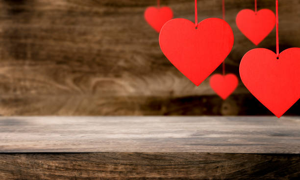 istock Red hearts on wooden table. 1457920435