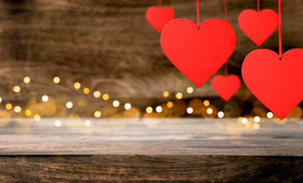 istock Red hearts on wooden table. 1457920498