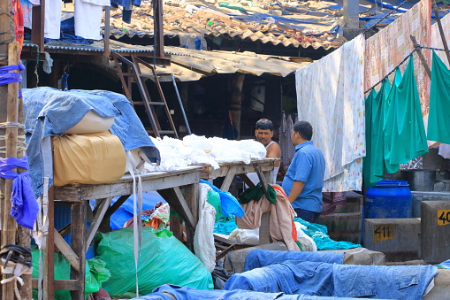 December 21 2022 - Mumbai, Maharashtra in India: People washing clothes in Dhobi Ghat Laundry District, a well known open air laundromat