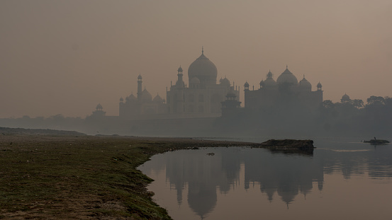 Agra, Uttar Pradesh, India - 08 Jan 2021 : The view on Taj Mahal from river side.