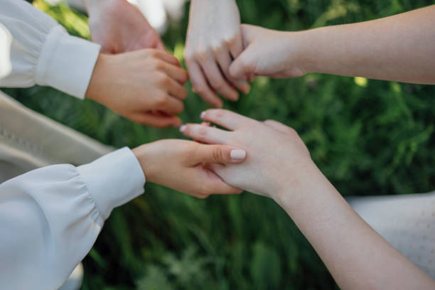 istock Close up of a woman's hand touching the grass, feeling nature 1457930147