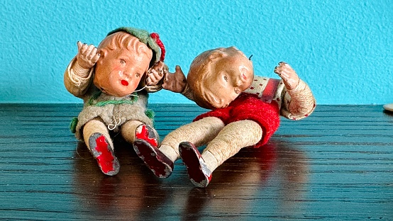 Vintage puppets children holding their own detached heads