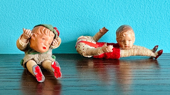 Vintage puppets children holding their own detached heads