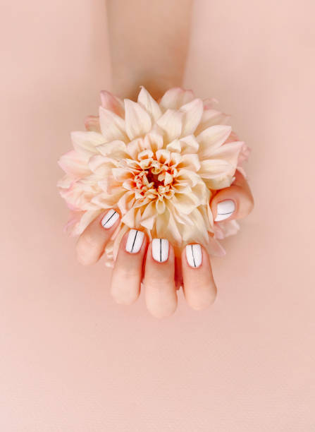 Woman with manicure and flower