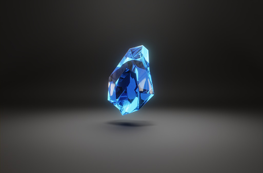 A levitating crystal gemstone on dark background. Abstract 3D computer creation.