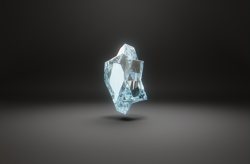 A levitating crystal gemstone on dark background. Abstract 3D computer creation.