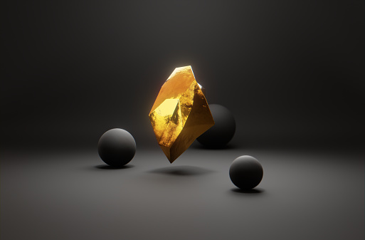 A levitating piece of gold surrounded by round spheres on black background.