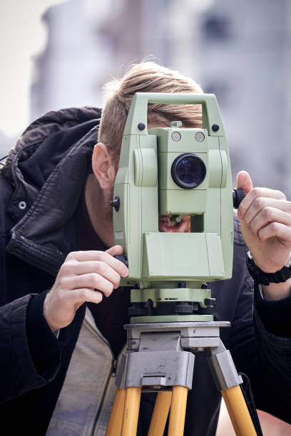 istock Theodolite instrument for measuring land angles during construction. 1457934176