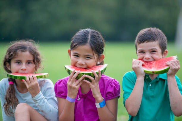 istock Children Eating Watermelon 1457934952