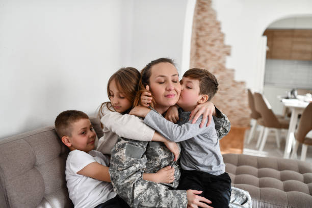 istock Beautiful Female Soldier Taking Time Spent With Offspring As Seriously As Her Work 1457935044