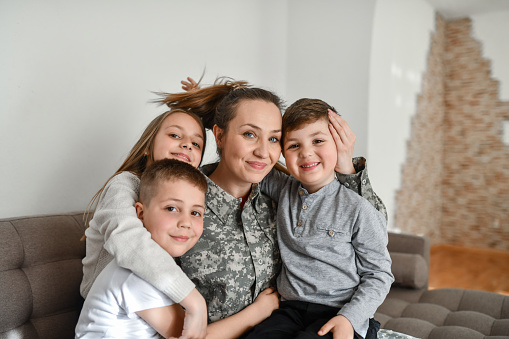 Smiling Female Soldier Excels At Being A Single Mother