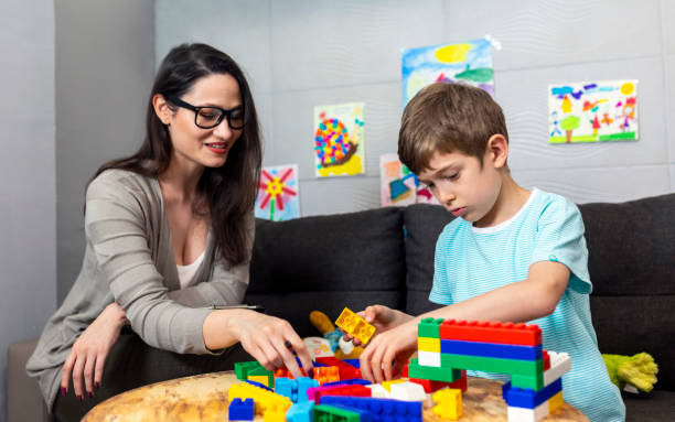 istock Elementary school boy in conversation with a psychotherapist 1457938328