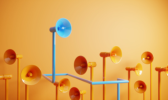 Orange colored megaphones, blue one on the top, can be used leadership/individuality concepts. (3d render)
