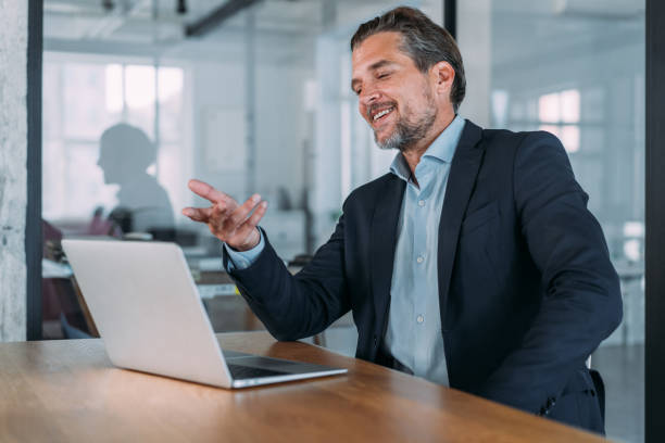 istock Businessman having video call in the office. 1457947897