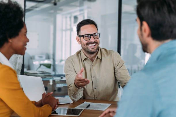 istock Group of business persons talking in the office. 1457948477