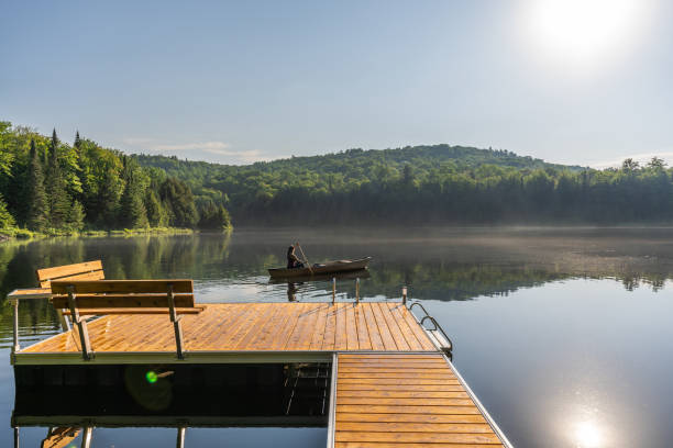 istock A woman canoeing in early morning. 1457949324