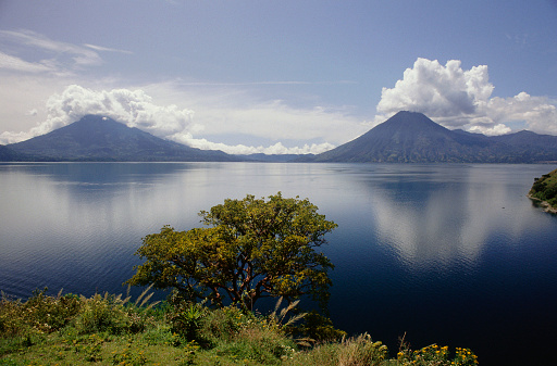 A view of two of the three volcanos , San Pedro and Tomilan, that ring \nlake Atitlan.