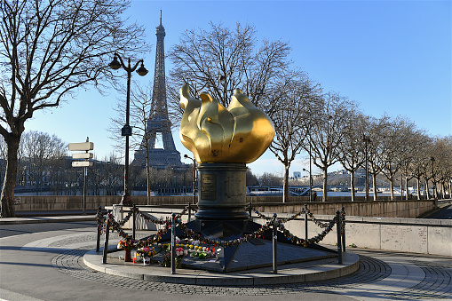 Paris, France-01 18 2023:The Flame of Liberty (Flamme de la Liberté) in Paris is a full-sized, gold-leaf-covered replica of the flame of the torch from the Statue of Liberty (Liberty Enlightening the World).The Flame of Liberty became an unofficial memorial for Diana, Princess of Wales, after her 1997 death in the tunnel beneath the Pont de l'Alma.