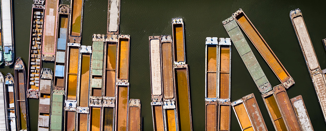 Empty barges moored on the canal on the Oder River near Szczecin, Poland