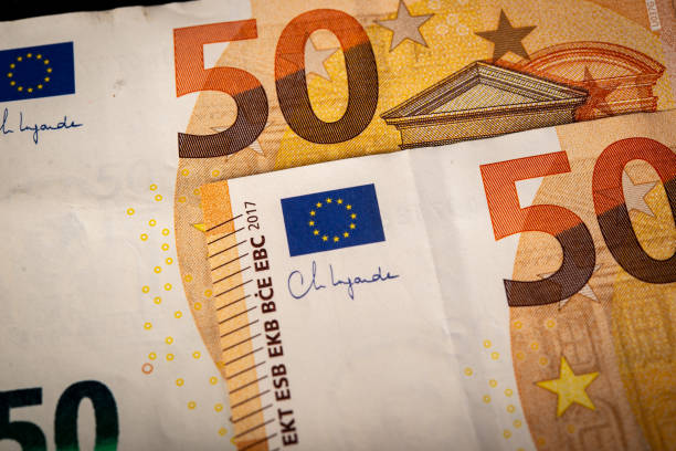 istock Closeup of 50 euro bank note making a background 1457951814