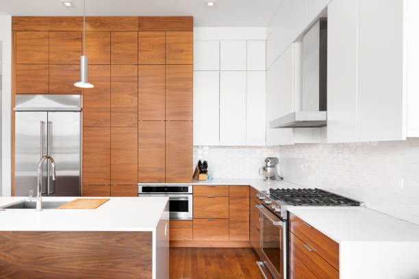 istock A kitchen with wood and white cabinets and a white pentagon tiled backsplash. 1457954669