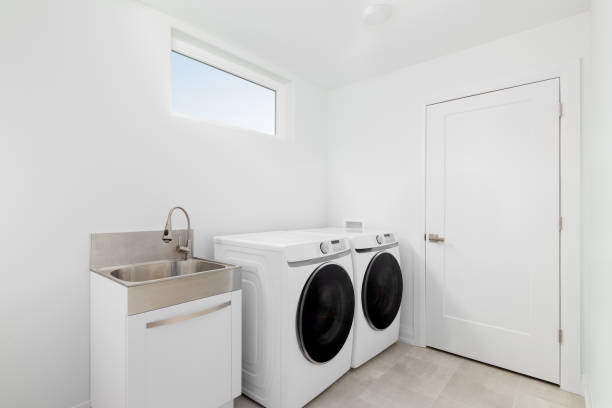 istock A laundry room with white appliances and tiled floor. 1457954839