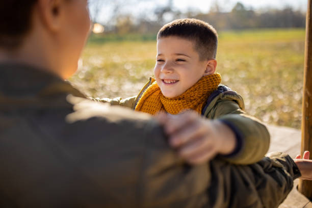 istock Boy with his mother 1457956478