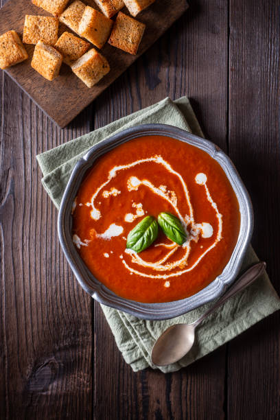 Tomato Soup Homemade Tomato Soup with Cream and Basil tomato soup stock pictures, royalty-free photos & images