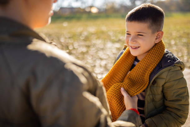 istock Boy with mom in nature 1457956728