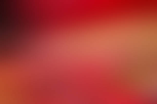 istock Blurred abstract gradient dark red pink color transition blend colorful frosted glass effect blur background 1457960480