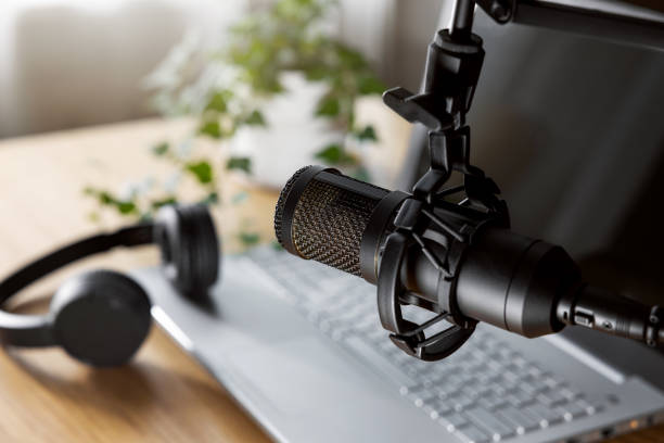 istock home studio for podcast recording, radio broadcasting. workplace of content creator. microphone closeup 1457961229