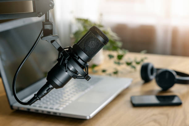 istock workplace of content creator. home studio for podcasting, online streaming, radio broadcasting. microphone closeup 1457961248