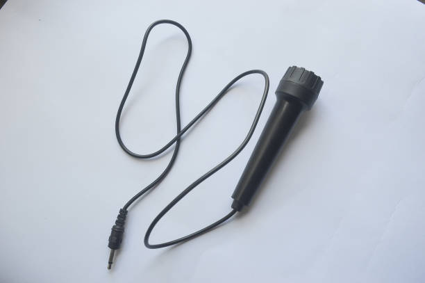 istock black children's toy microphone on a white background 1457962573
