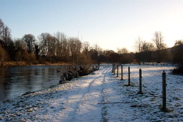 pathway eastwards by river Tweed on early winters morning stock photo