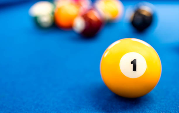 istock A number 1 billiard at a blue pool table. 1457967525
