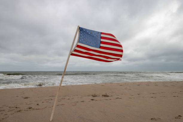 istock An American Flag on the beach 1457972061
