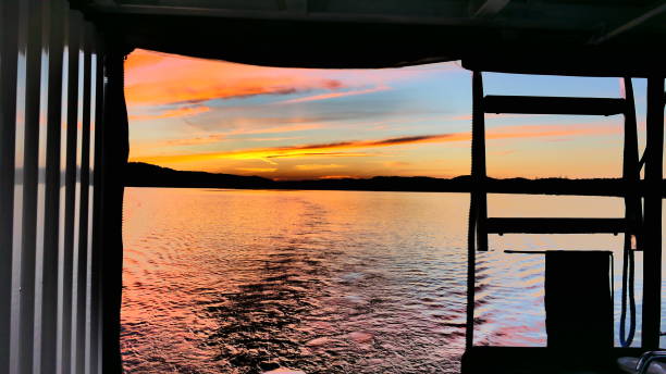 istock Sunset over the river seen from inside a boat 1457972446