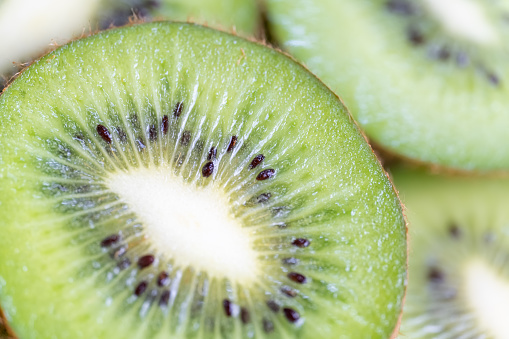 Close-up of slice of kiwi fruit with appetizing and healthy appearance
