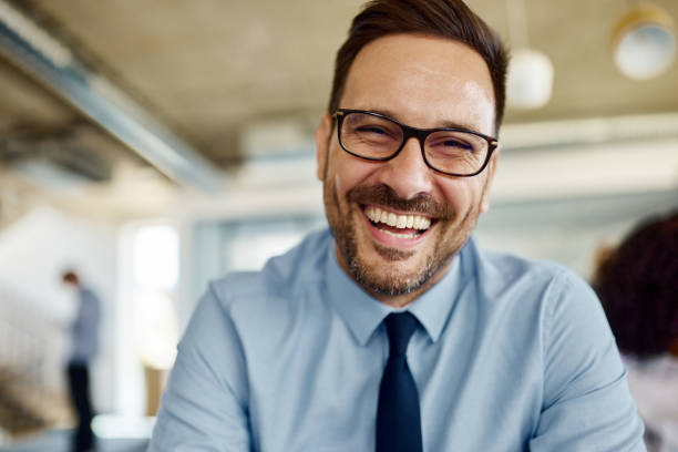 istock Young happy businessman looking at camera. 1457980859