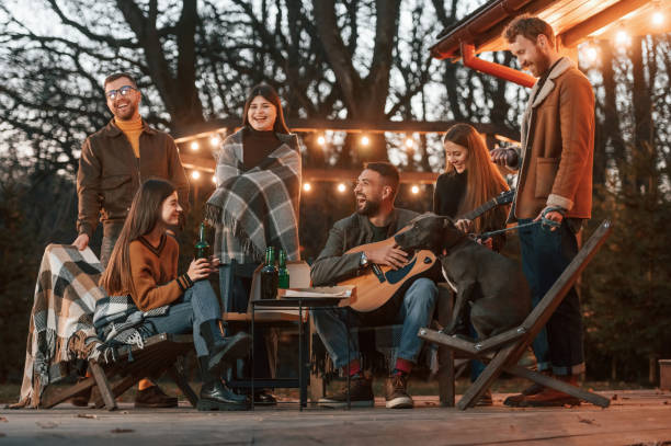 istock Group of people is spending time together on the backyard at evening time 1457982677